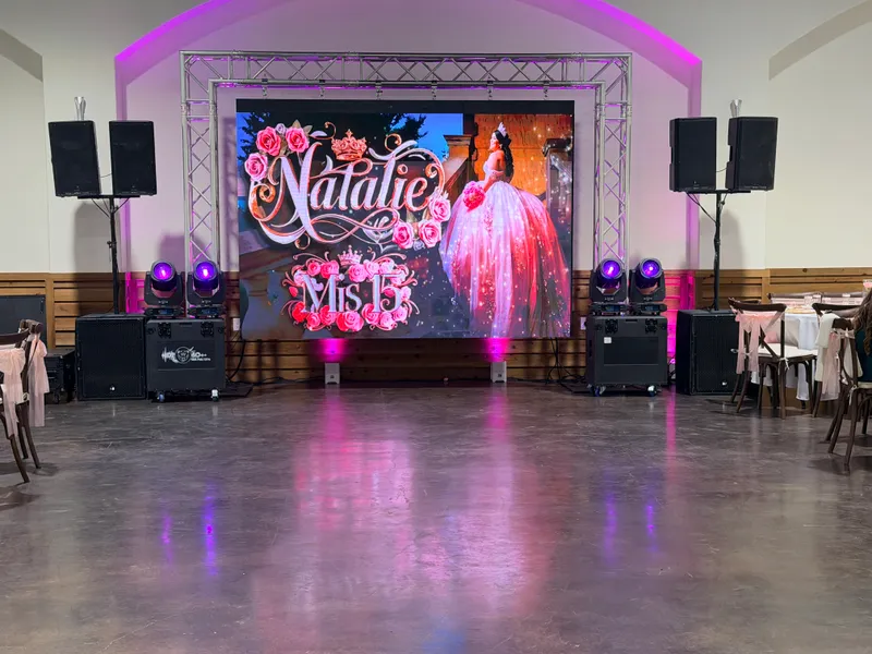 Custom LED video wall backdrop reading Natalie Mis 15 flanked by DJ Oso sound and lighting equipment at a Dallas-Fort Worth quinceañera